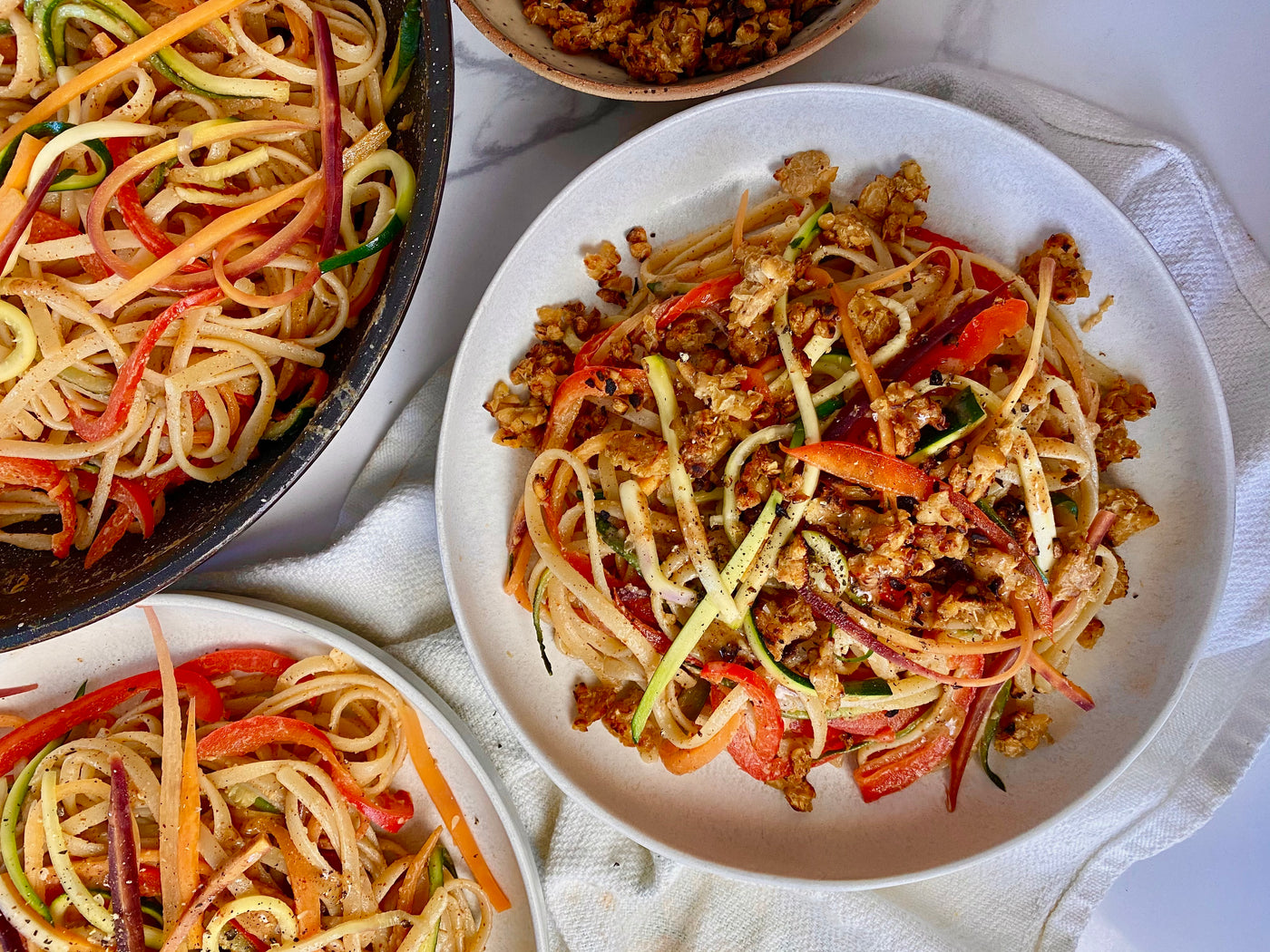 Spicy Almond Butter Rainbow Noodles with Tempeh Crumbles